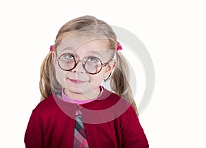 Close-up portrait of little girl wearing glasses