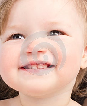 Close up portrait of little smiling child