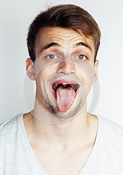 Close up portrait of loudly laughing young man