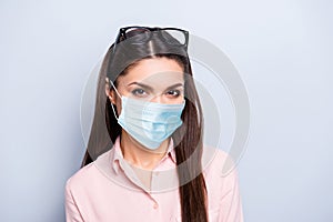 Close-up portrait of lovely girl wearing safety gauze mask mers cov prevention healthcare isolated on gray color