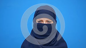 Close up portrait of lovely young muslim business woman wearing hijab headscarf looking confident smiling calm