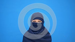 Close up portrait of lovely young muslim business woman wearing hijab headscarf looking confident smiling calm