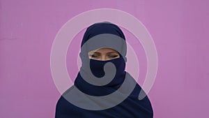 Close up portrait of lovely young muslim business woman wearing hijab headscarf looking confident smiling calm