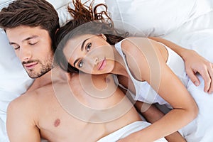 Close-up portrait of lovers sleeping together in bed
