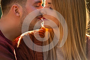 Close up portrait of a loving couple kissing.