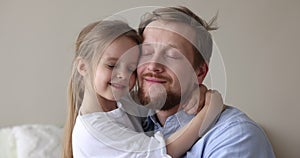 Close up portrait loving father and little adorable daughter
