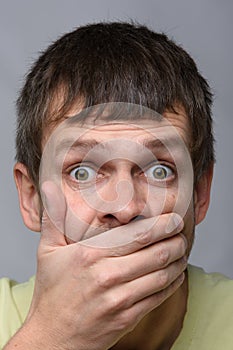 Close-up portrait of a man of European appearance, depicting a fright