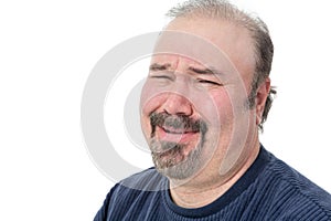 Close-up portrait of a man laughing in disbelief