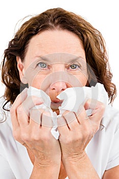 Close-up of portrait mature woman suffering from cold