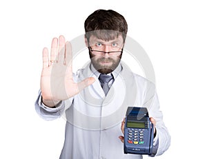 Close-up portrait of a medical doctor, he proposes to pay for treatment in pos-terminal. concept of high cost of the