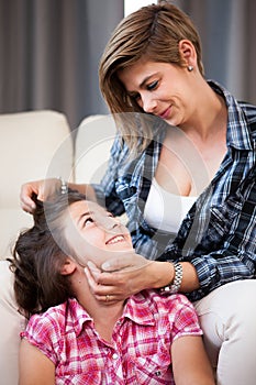 Close up portrait of mother looking lovely at her daughter