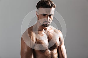 Close up portrait of a muscular mature shirtless sportsman