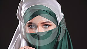 Close-up portrait of a muslim woman in national clothes.