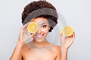 Close-up portrait of nice attractive cheerful healthy wavy-haired girl holding in hand orange pieces closing eye monocle