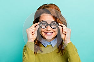 Close-up portrait of nice attractive content cheerful cheery wavy-haired girl scientist touching thick glasses learning