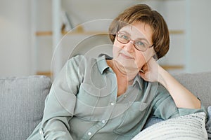 Close-up portrait of a older woman at home