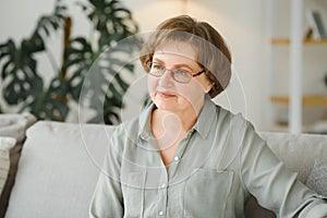 Close-up portrait of a older woman at home