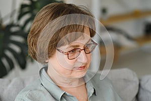 Close-up portrait of a older woman at home