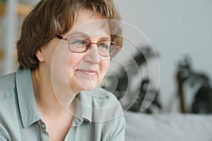 Close-up portrait of a older woman at home