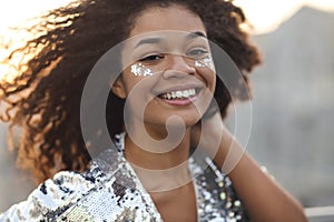 Close up portrait of overjoyed charming african american woman with curly hair