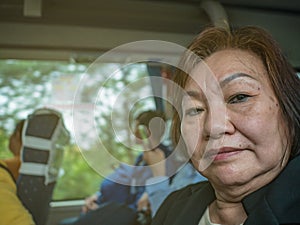 Close up portrait Photo of Senior asian women in the bus at changsha city china