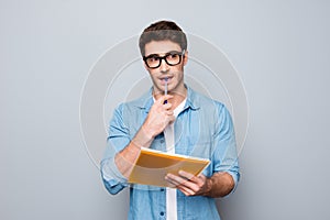 Close up portrait of pondering handsome lovely adorable cute smart clever attractive intelligent guy biting pen thinking how to so