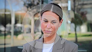 Close up portrait of powerful business woman looking serious at camera standing at workplace. Elegant office secretary