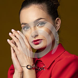 Close up portrait of pretty girl in red with necklace