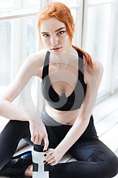 Close-up portrait of a pretty girl resting at gym