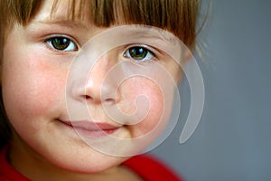 Close-up portrait of a pretty little girl