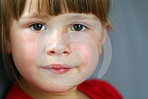 Close-up portrait of a pretty little girl