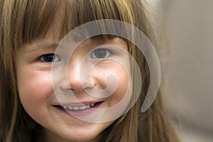 Close-up portrait of pretty little girl. Smiling child