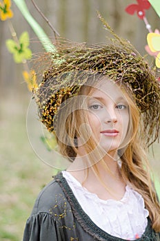 Close up portrait of a pretty pensive girl in a folk circlet