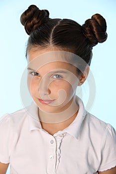 Close-up portrait of a pretty stylish brunette child girl looks in disbelief