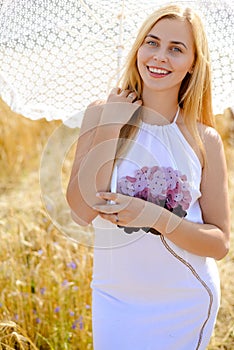 Close up portrait of pretty young blond lady under