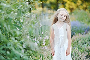 Close up portrait of pretty, young, blue eyed, fair skinned girl with happy and peaceful expression