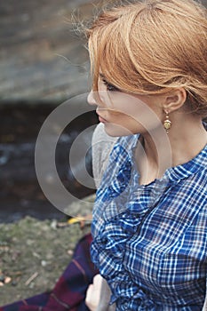 Close-up portrait in profile of woman in retro style outdoor