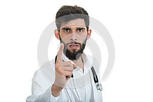 A close-up portrait of a rude, frustrated, upset doctor isolated on a white background