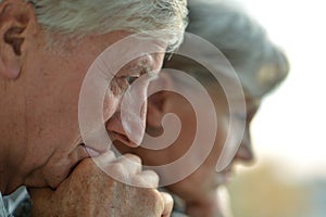 Close-up portrait of a sad elder couple