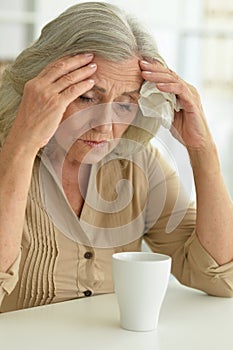 Close up portrait of sad ill senior woman