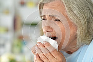 Close up portrait of sad ill senior woman