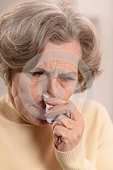 Close up portrait of sad ill senior woman