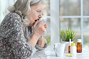 Close up portrait of sad ill senior woman