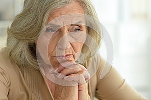 Close up portrait of sad senior woman