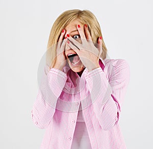 Close-up portrait of the scared woman, isolated on white.