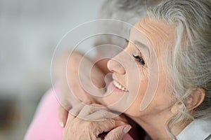 Close up portrait of senior couple hugging