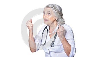 Close up portrait of senior female doctor with fists