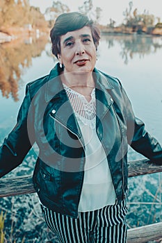 Close up portrait of a senior woman in the summer park