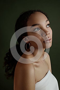 Close up portrait of sensual young female. Clean skin. Healthy care. Portrait of beautiful african american in hat