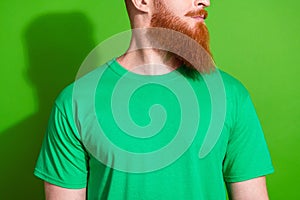 Close up portrait of serious handsome guy with long red beard wear stylish t-shirt look empty space isolated on green